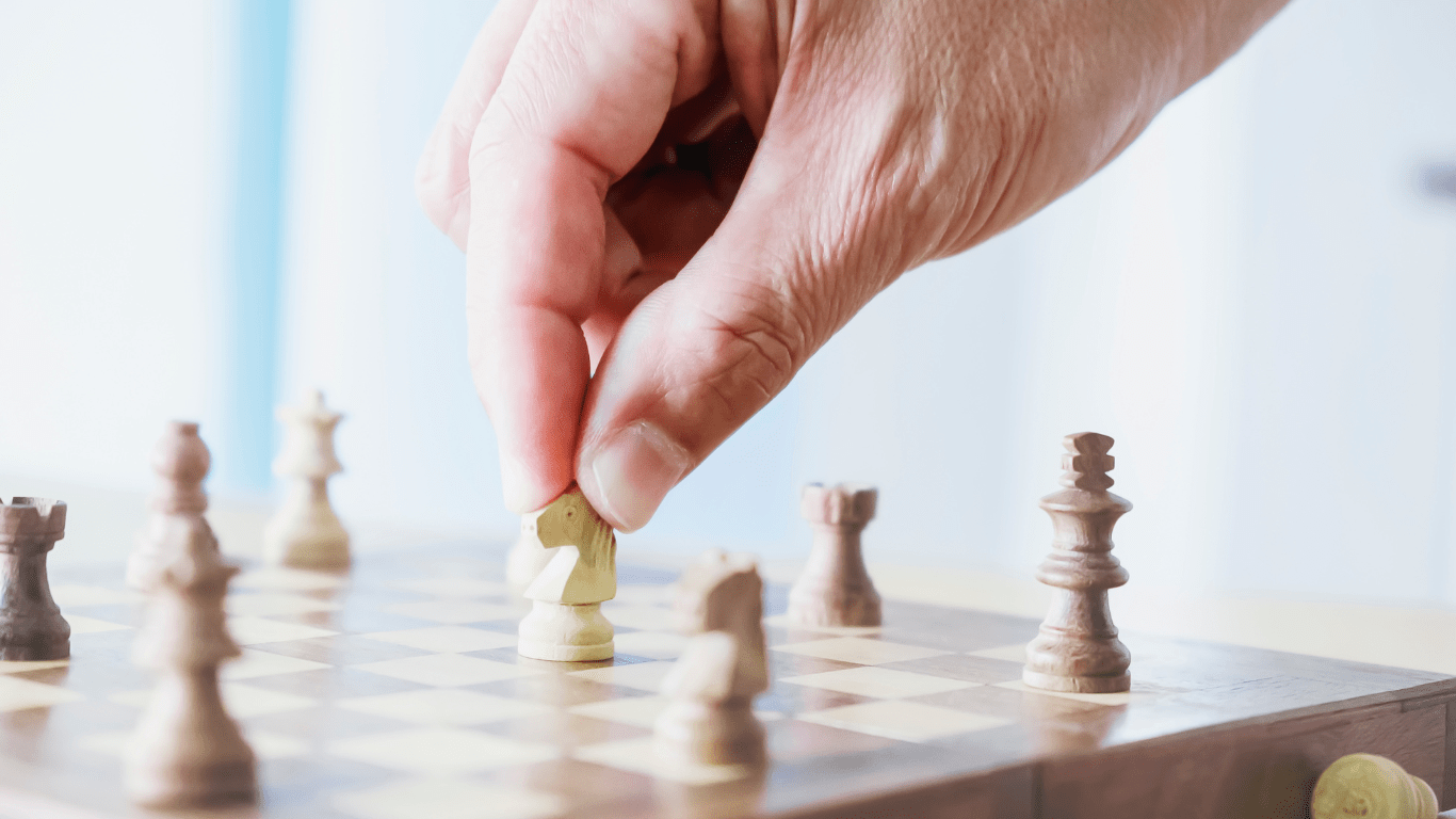 a man playing chess by using strategy