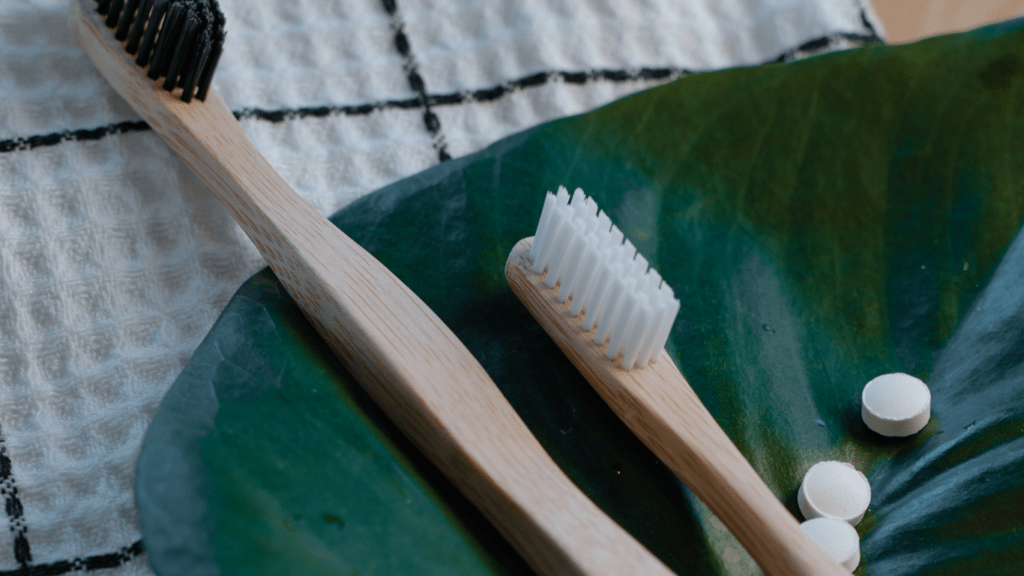 a pair of wooden toothbrush to promote sustainability