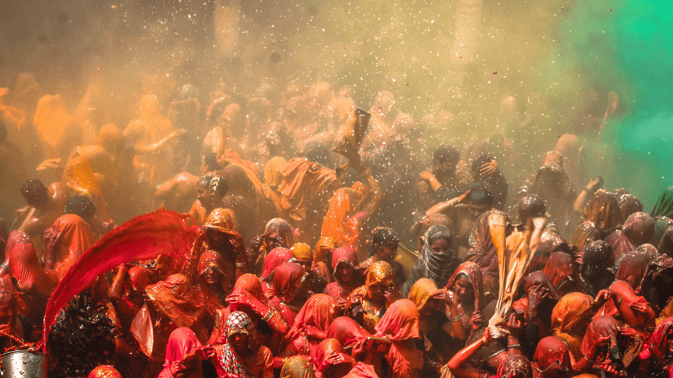 crowd of people celebrating holi festival