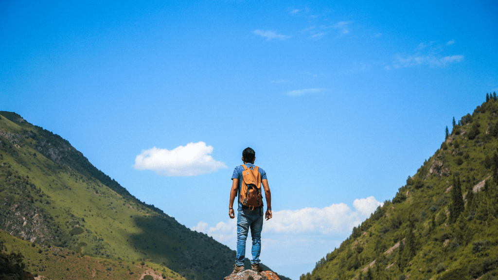 an explorer on top of a mountain