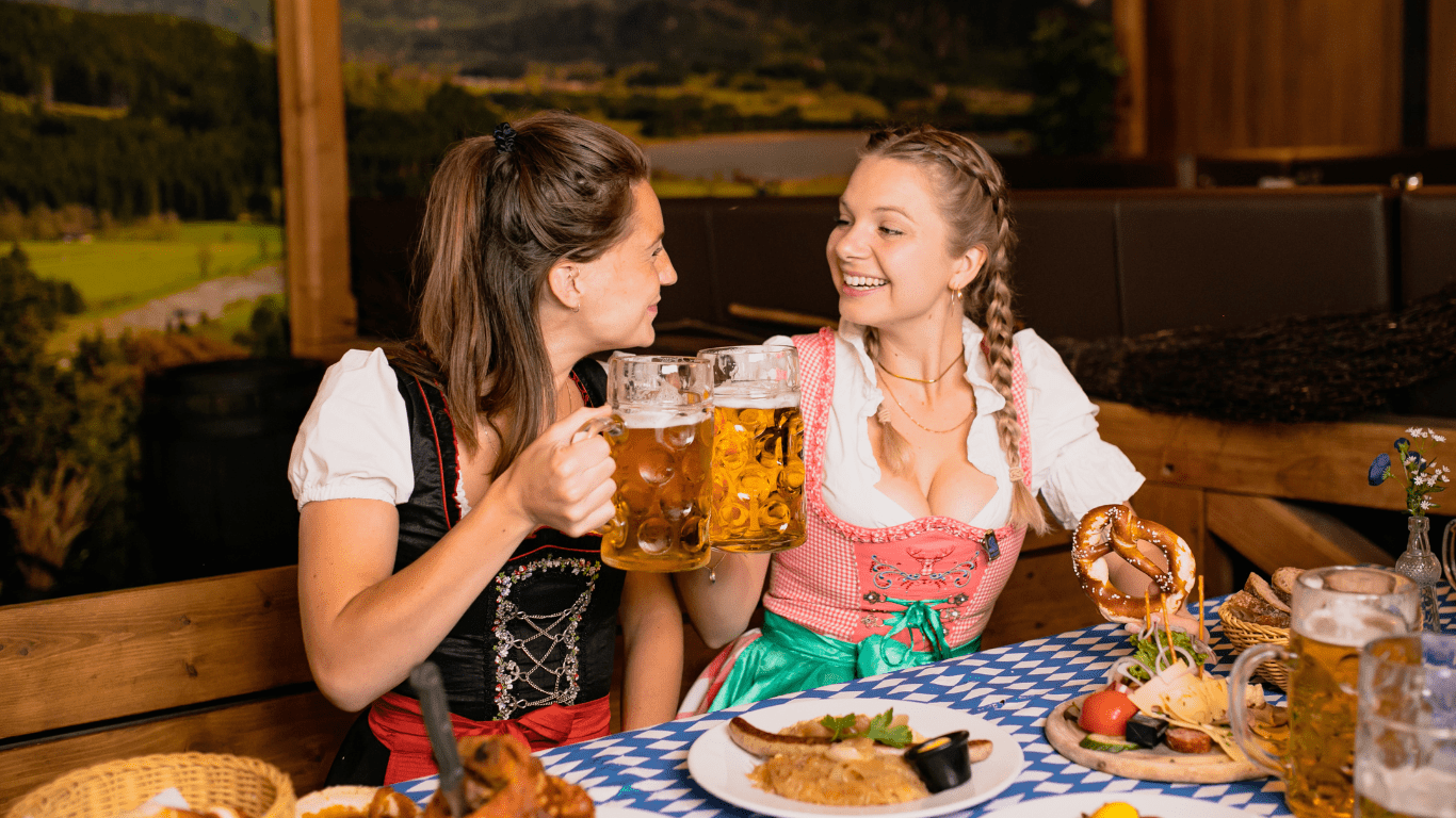 two people celebrating oktoberfest in germany