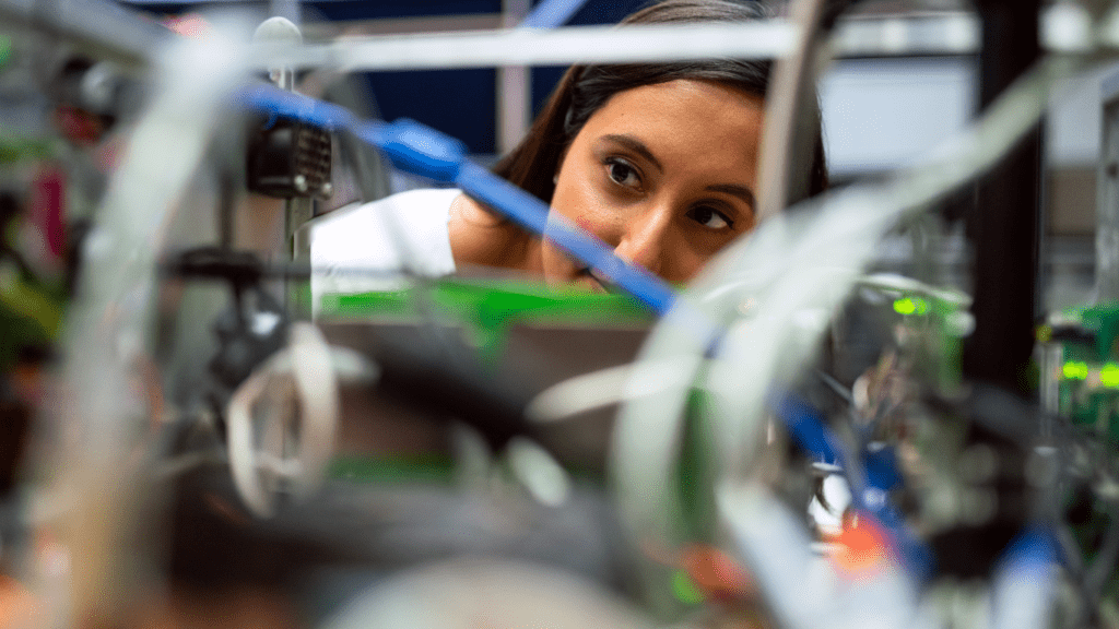 a woman checking on a hardware installation