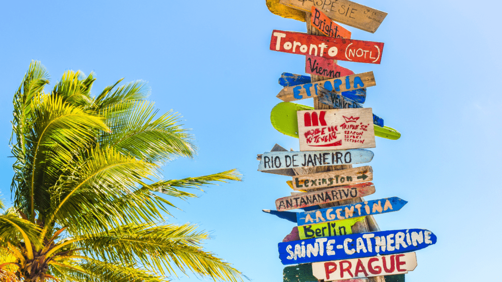 signs of different tourist destination